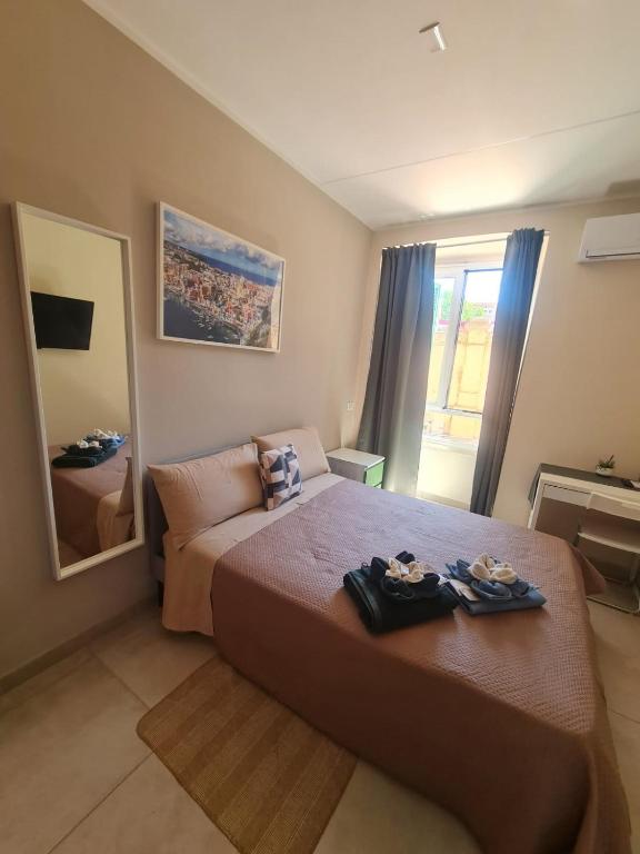 Postel nebo postele na pokoji v ubytování B&B LE TRE ISOLE