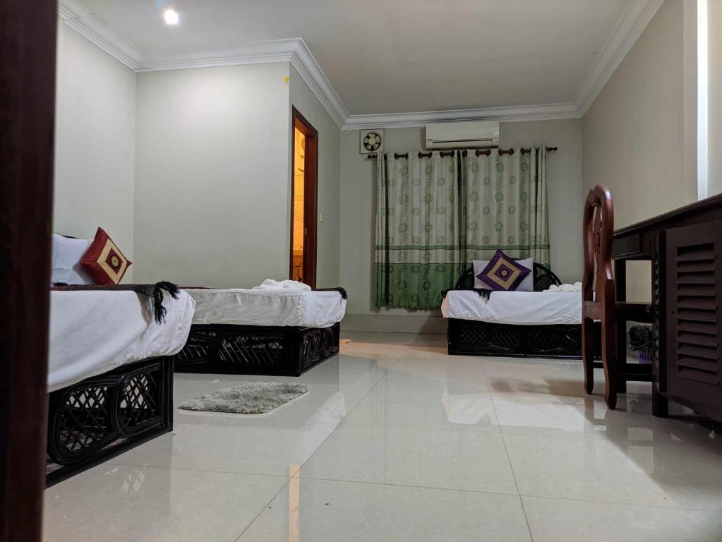 Postel nebo postele na pokoji v ubytování IKI IKI Guesthouse