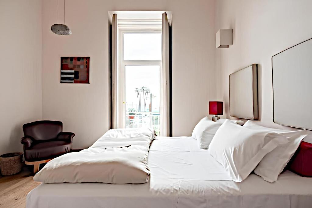 Łóżko lub łóżka w pokoju w obiekcie Micalò Art Rooms