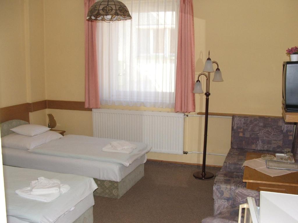 Postel nebo postele na pokoji v ubytování Apollo Motel