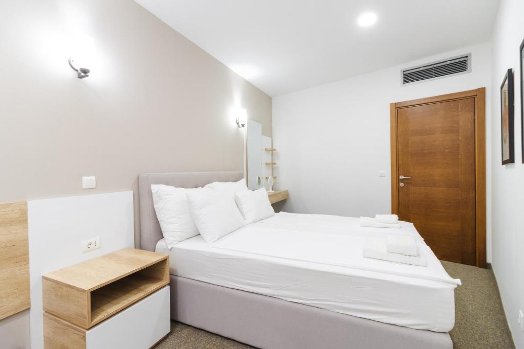Vuode tai vuoteita majoituspaikassa Lux Hotel M