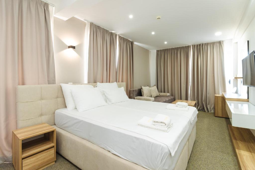 Vuode tai vuoteita majoituspaikassa Lux Hotel M
