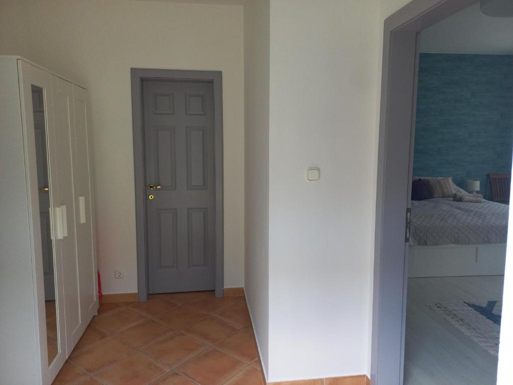 Postel nebo postele na pokoji v ubytování Kertész14 Apartman