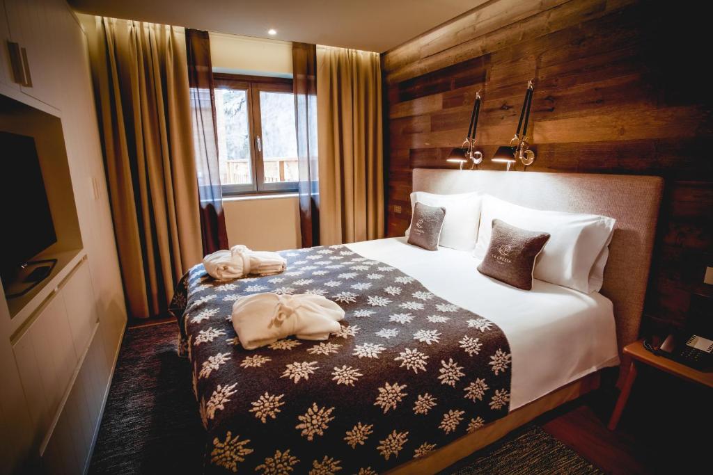Letto o letti in una camera di La Cresta Chalet