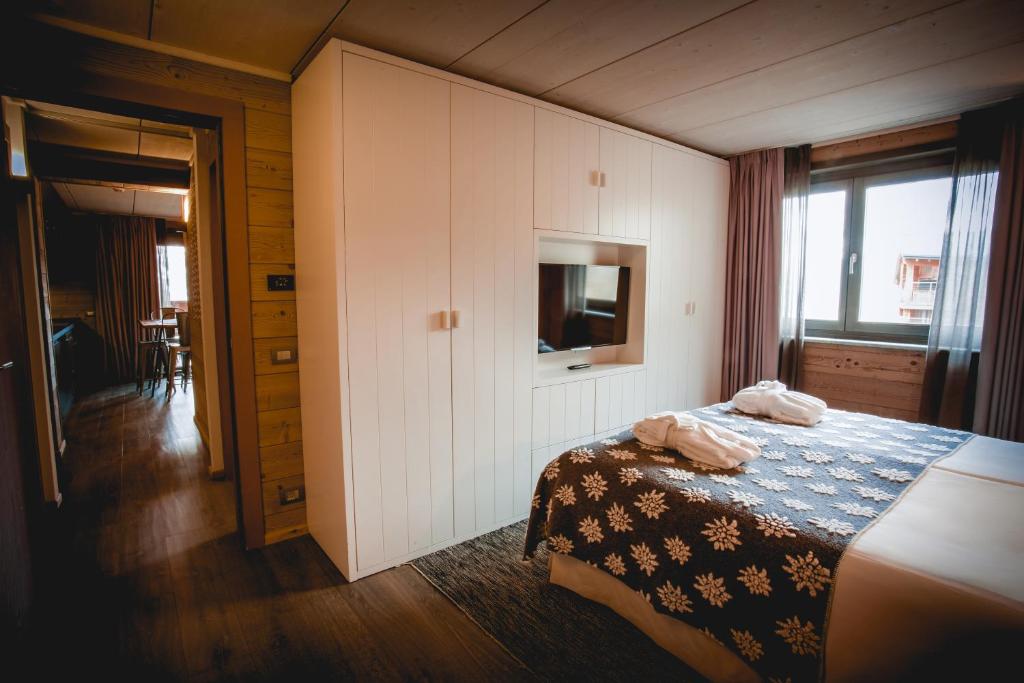 Letto o letti in una camera di La Cresta Chalet