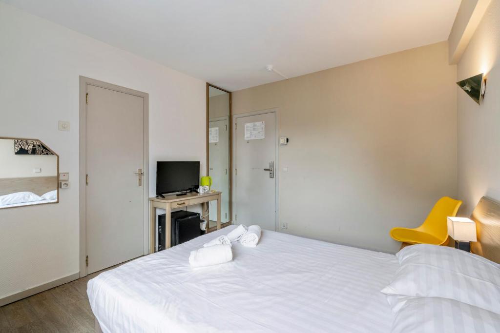 Postel nebo postele na pokoji v ubytování Sleep & Go Brussels South