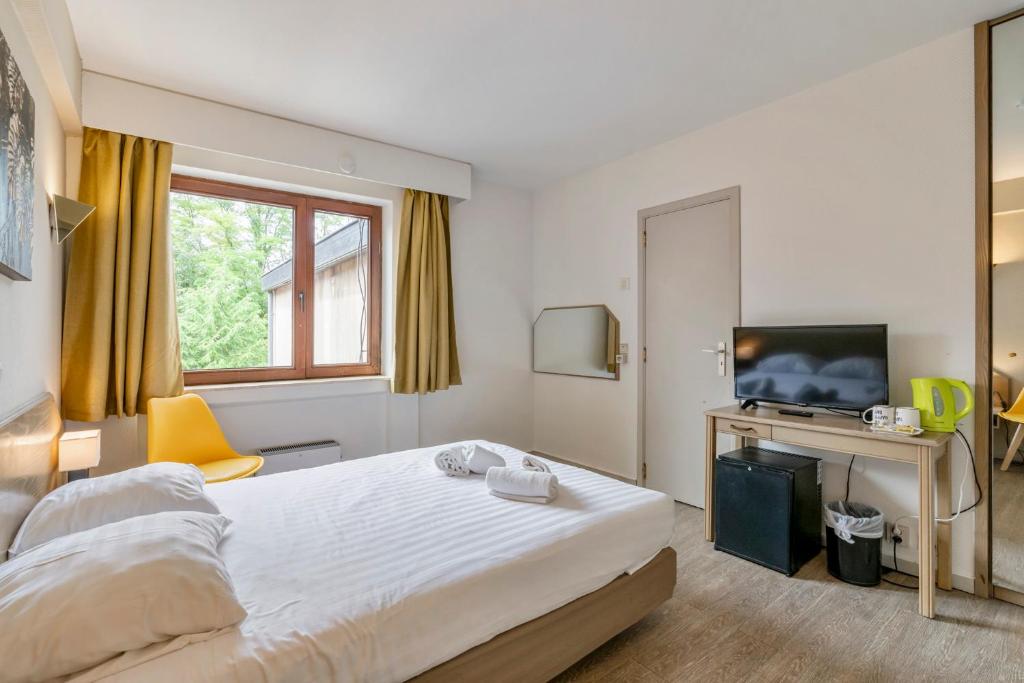 Postel nebo postele na pokoji v ubytování Sleep & Go Brussels South