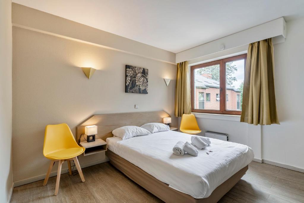 Postel nebo postele na pokoji v ubytování Sleep & Go Brussels South