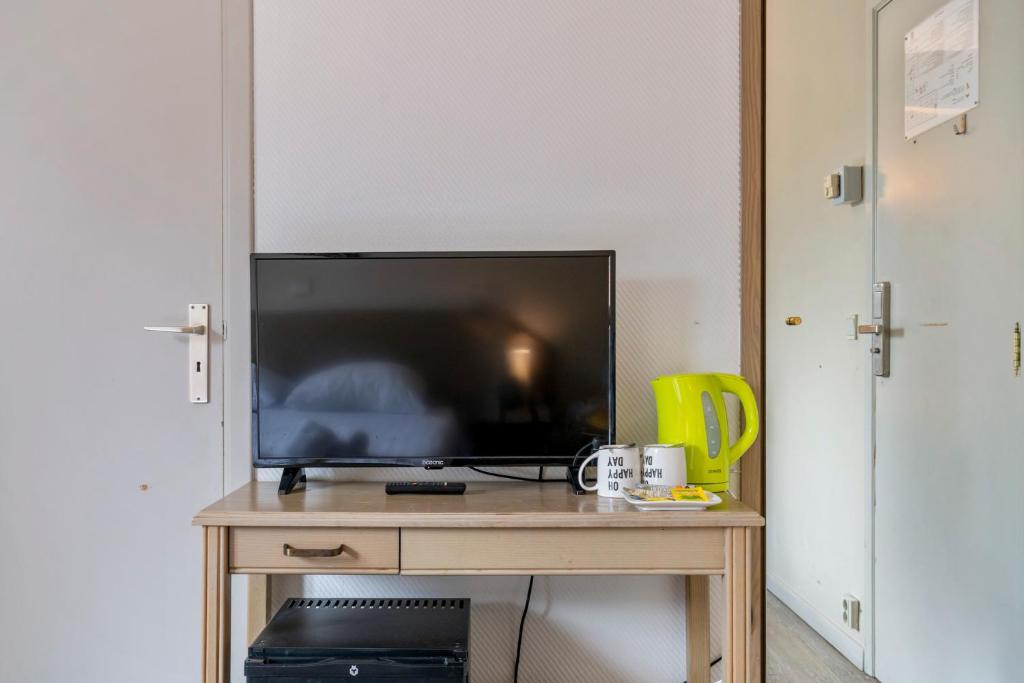 TV a/nebo společenská místnost v ubytování Sleep & Go Brussels South