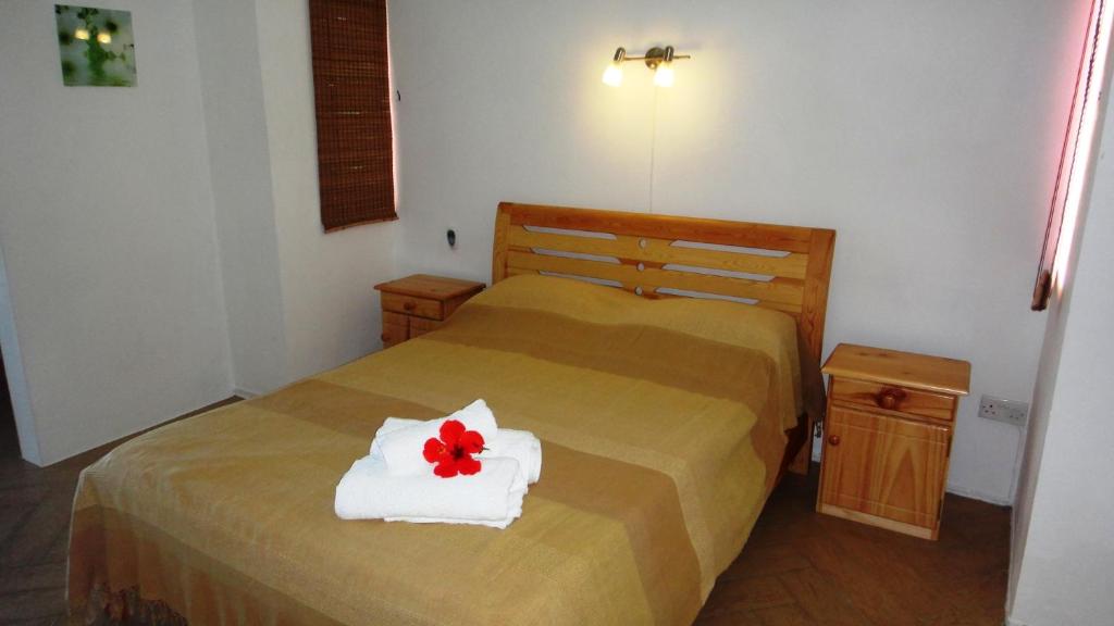 Letto o letti in una camera di Colibri Beach Villas