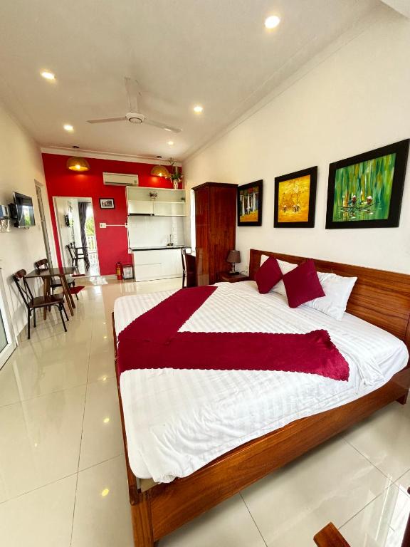 Postel nebo postele na pokoji v ubytování Red House Homestay - Villa