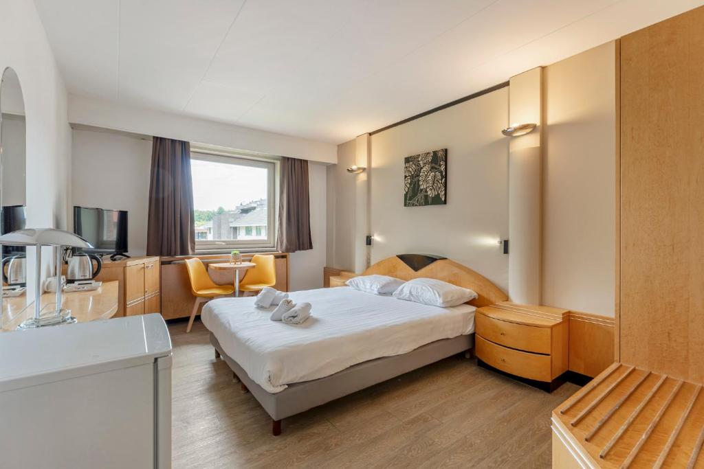 Postel nebo postele na pokoji v ubytování Sleep & Go Brussels South