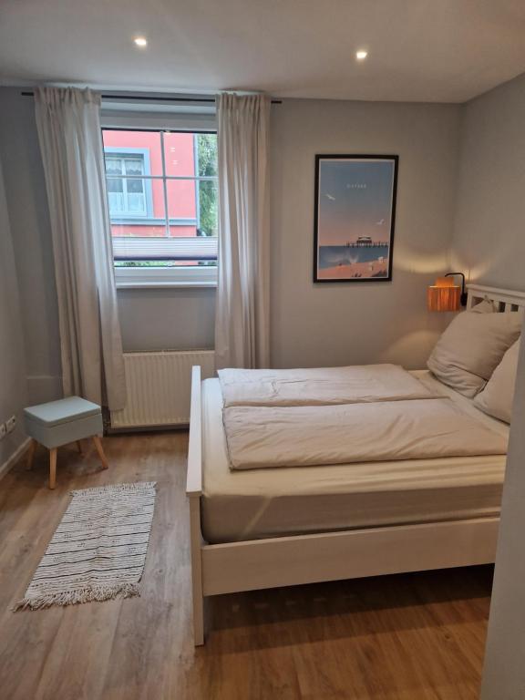 Postel nebo postele na pokoji v ubytování Haus am Markt