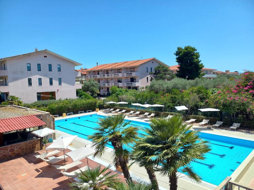 Bazén v ubytování Green Sporting Club Hotel nebo v jeho okolí