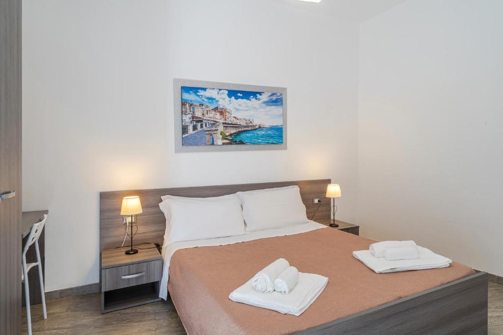 Postel nebo postele na pokoji v ubytování Cavour Rooms