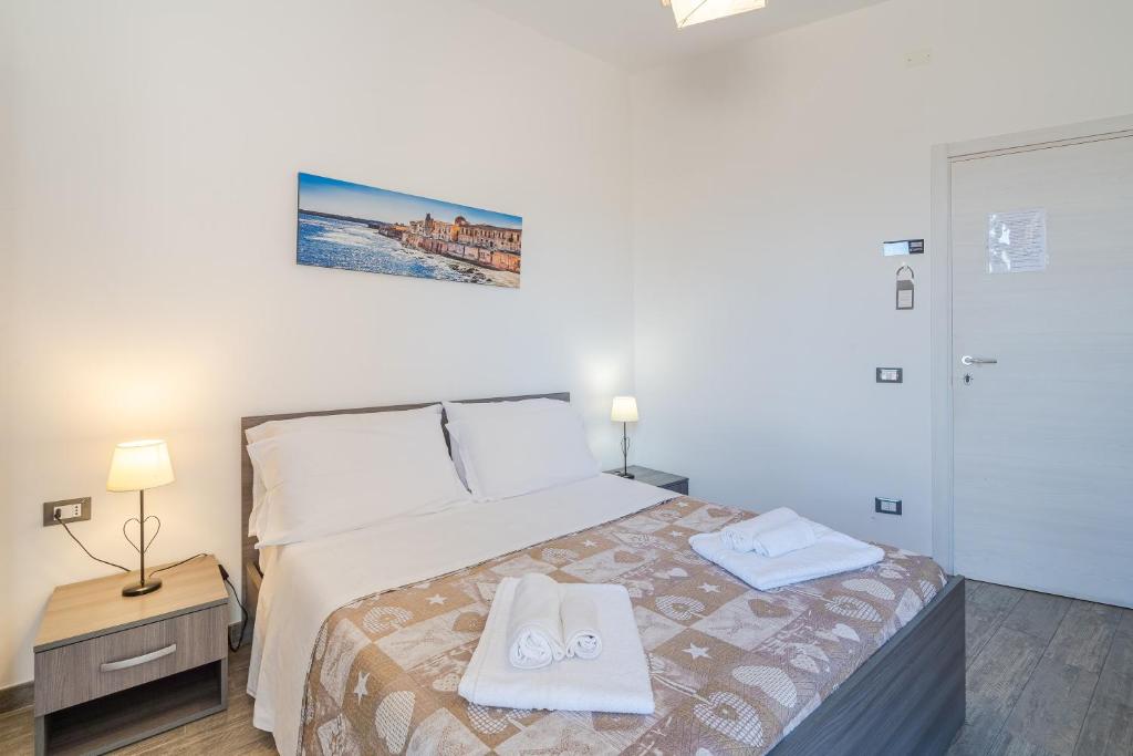 Postel nebo postele na pokoji v ubytování Cavour Rooms