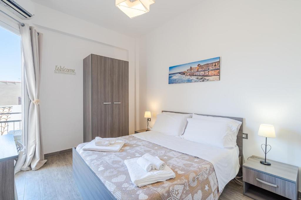 Postel nebo postele na pokoji v ubytování Cavour Rooms