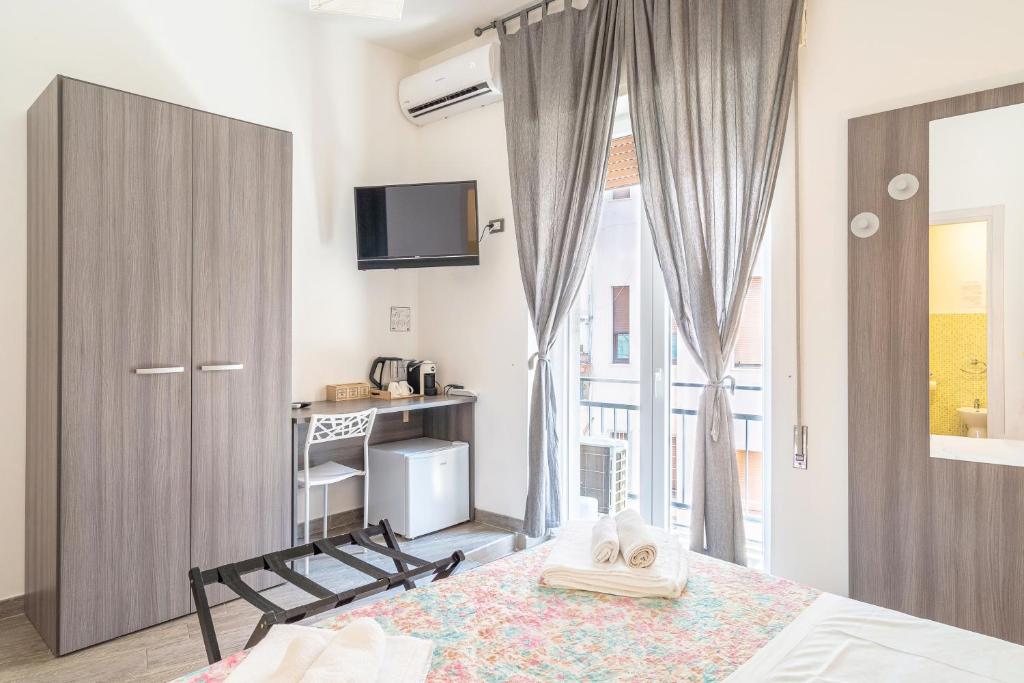Postel nebo postele na pokoji v ubytování Cavour Rooms