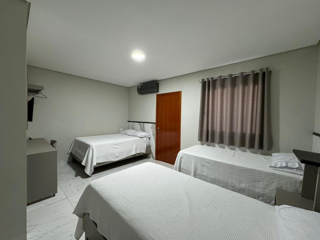 Postel nebo postele na pokoji v ubytování Hotel Radan
