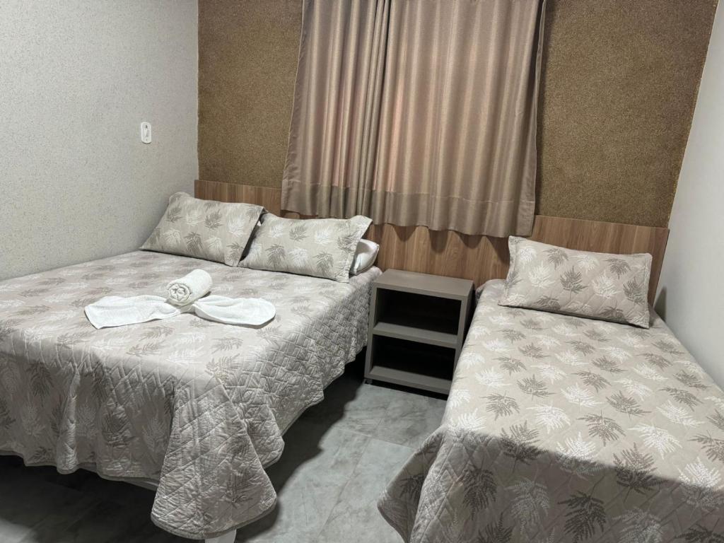 Postel nebo postele na pokoji v ubytování Hotel Radan