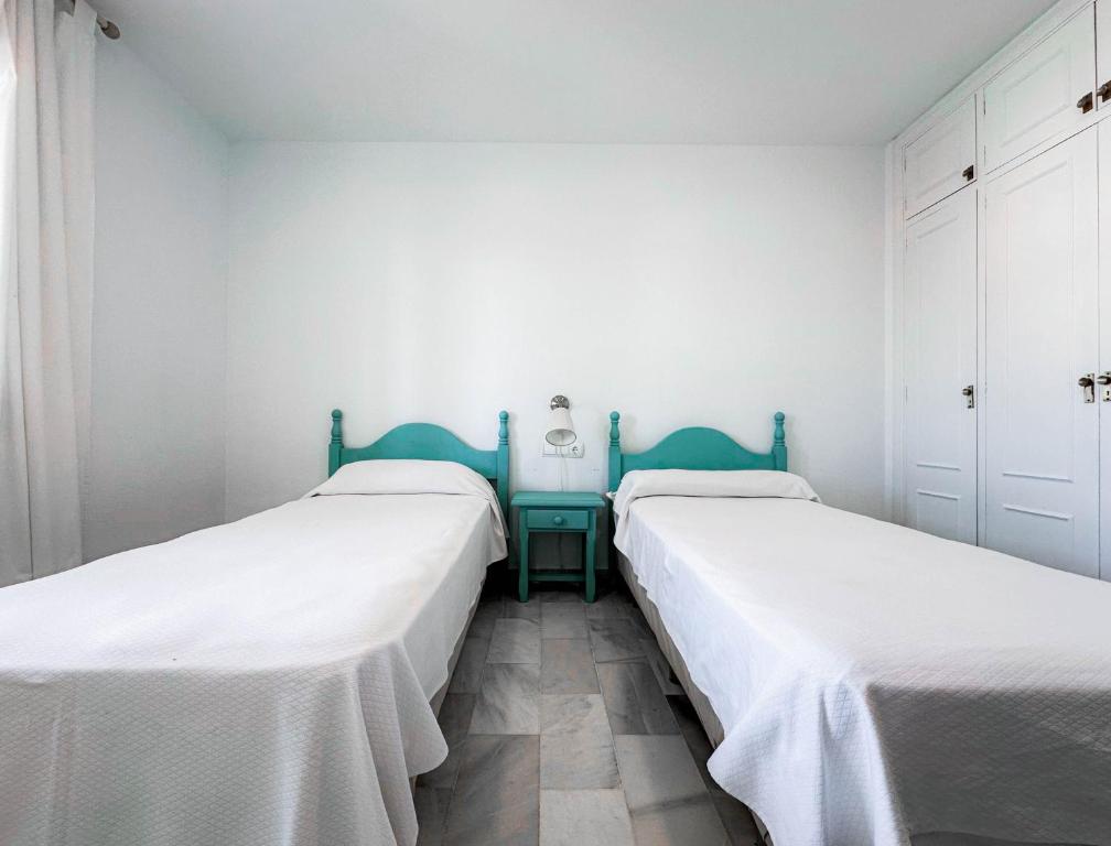 Łóżko lub łóżka w pokoju w obiekcie 3-401-Apartamento 1 dormitorio