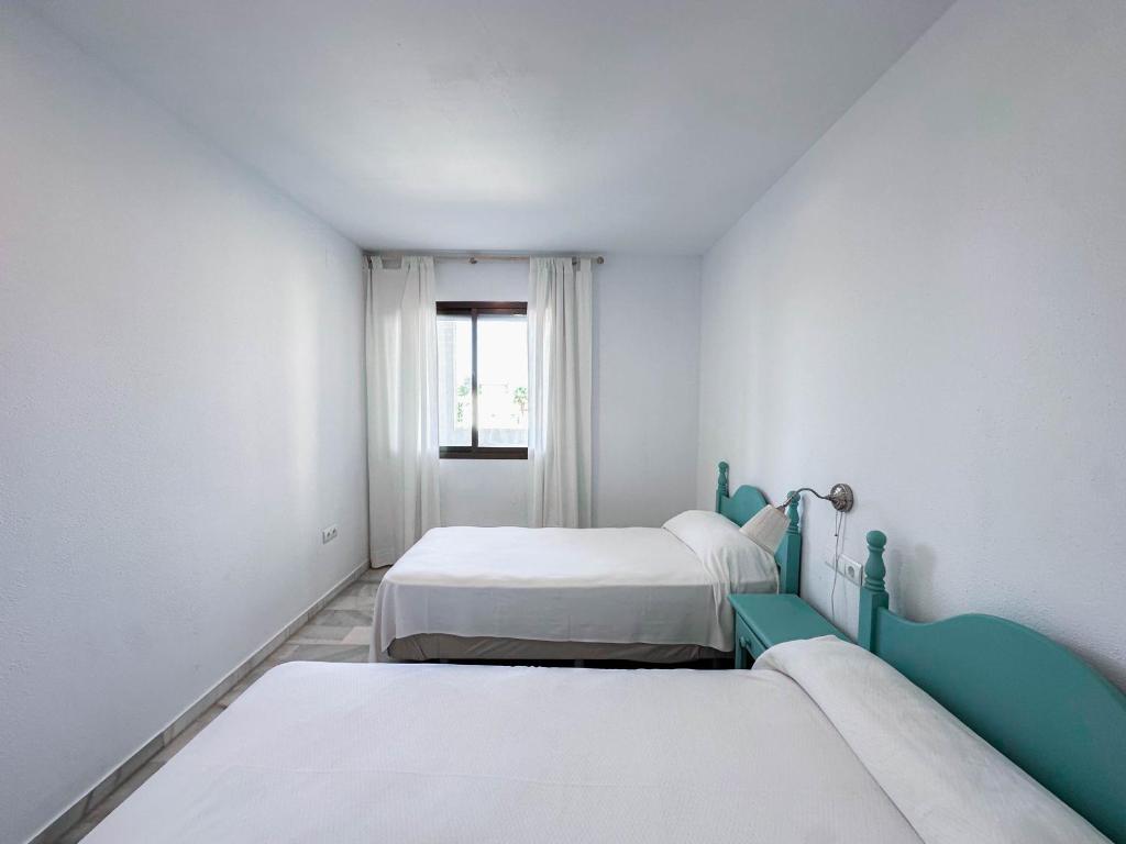 Łóżko lub łóżka w pokoju w obiekcie 3-401-Apartamento 1 dormitorio