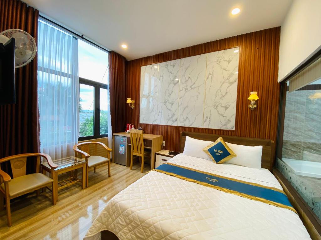 Postel nebo postele na pokoji v ubytování Hotel Phi Hùng