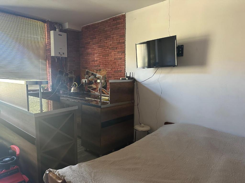 TV a/nebo společenská místnost v ubytování Guest House Nana