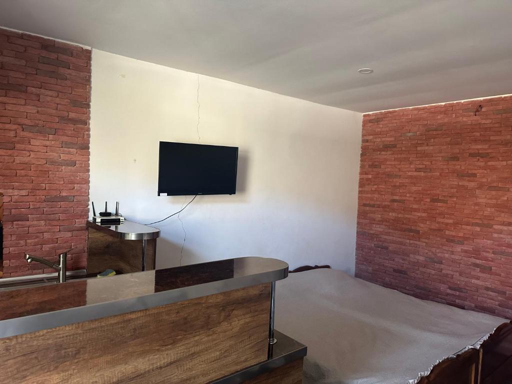 TV a/nebo společenská místnost v ubytování Guest House Nana