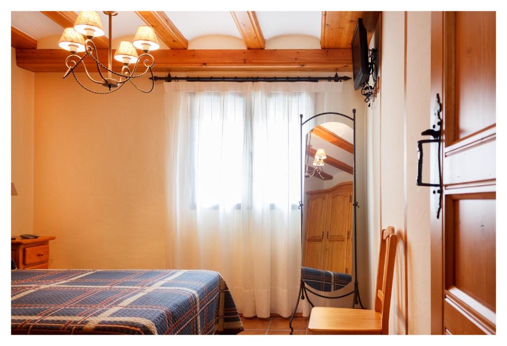 A bed or beds in a room at El Casal de Nicolás