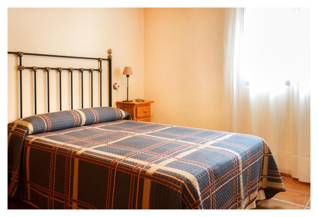 A bed or beds in a room at El Casal de Nicolás