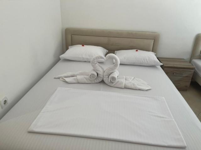 Postel nebo postele na pokoji v ubytování Apartments Luana