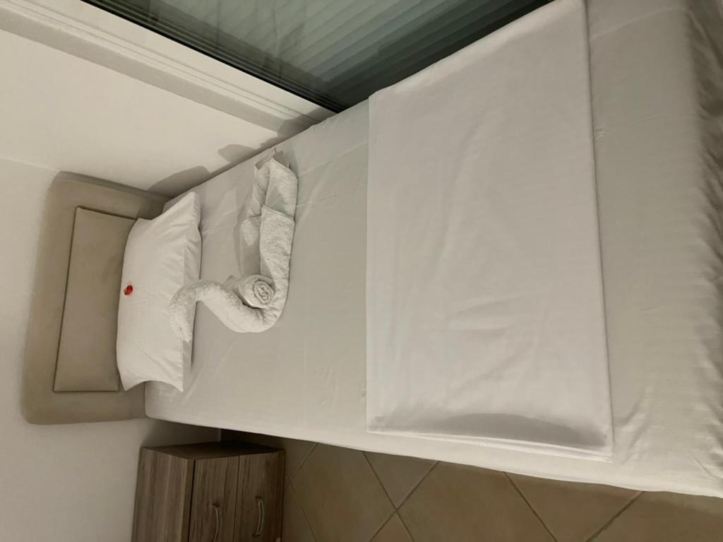 Postel nebo postele na pokoji v ubytování Apartments Luana