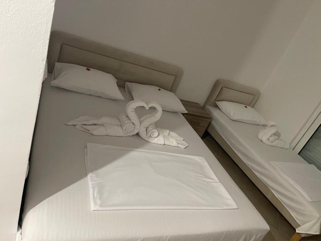 Postel nebo postele na pokoji v ubytování Apartments Luana