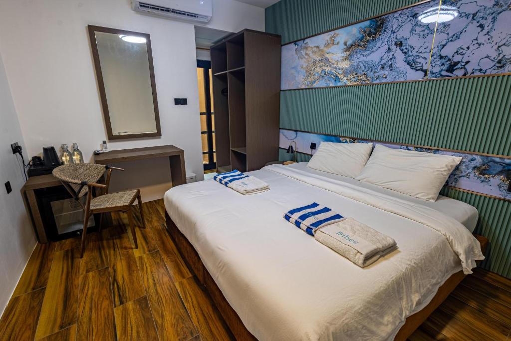 Postel nebo postele na pokoji v ubytování Bibee Maldives