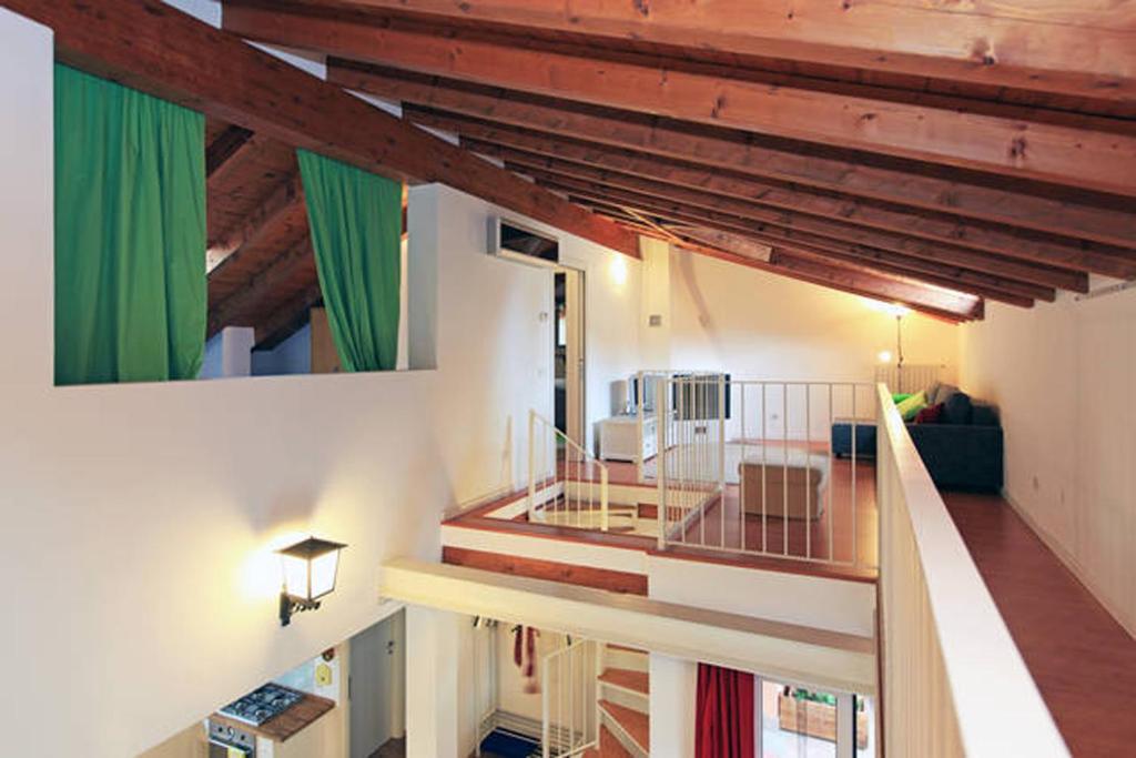 a view of a living room from the second floor of a house at Navigli Downtown Cocco House in Milan