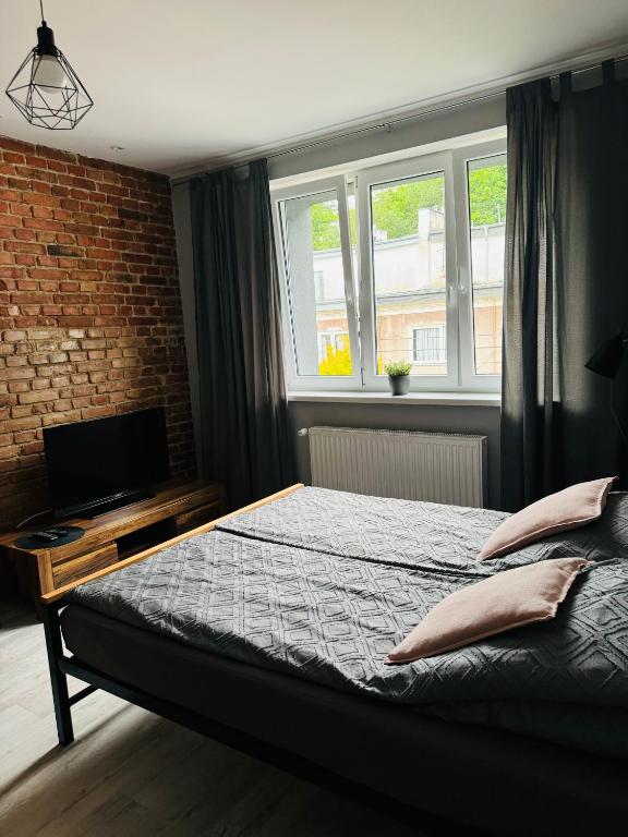 Postel nebo postele na pokoji v ubytování Apartamenty ToTuGdynia 7