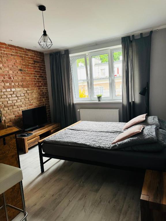 Postel nebo postele na pokoji v ubytování Apartamenty ToTuGdynia 7