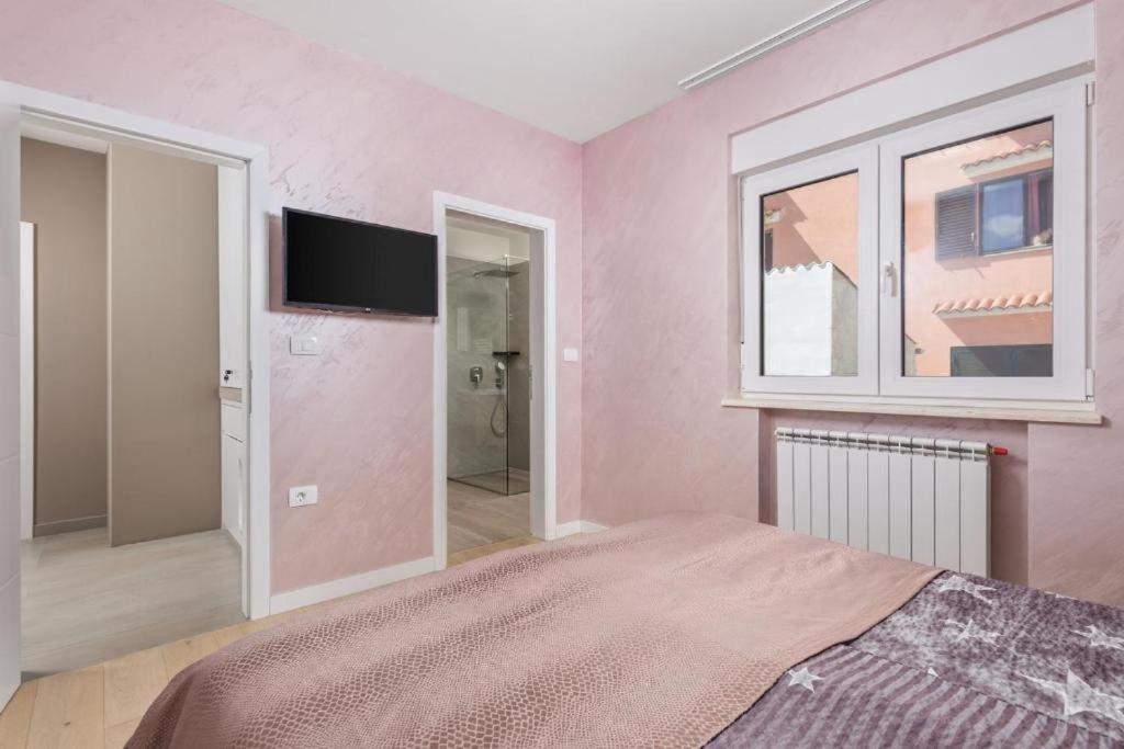 Łóżko lub łóżka w pokoju w obiekcie Villa Jessica