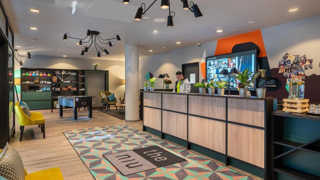 Uma TV ou centro de entretenimento em Holiday Inn - the niu, Charly Frankfurt City by IHG