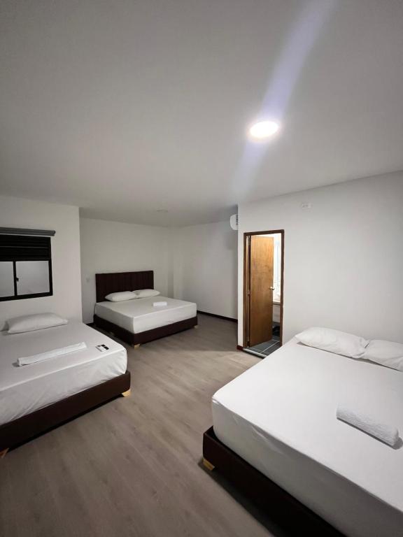 Postel nebo postele na pokoji v ubytování Hotel Gallery By 70