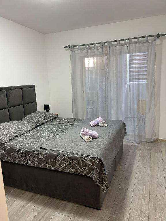 Posteľ alebo postele v izbe v ubytovaní Apartment Arbanija 1122a