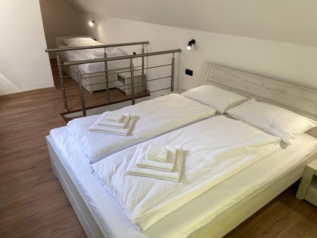 Postel nebo postele na pokoji v ubytování M3-Apartmány