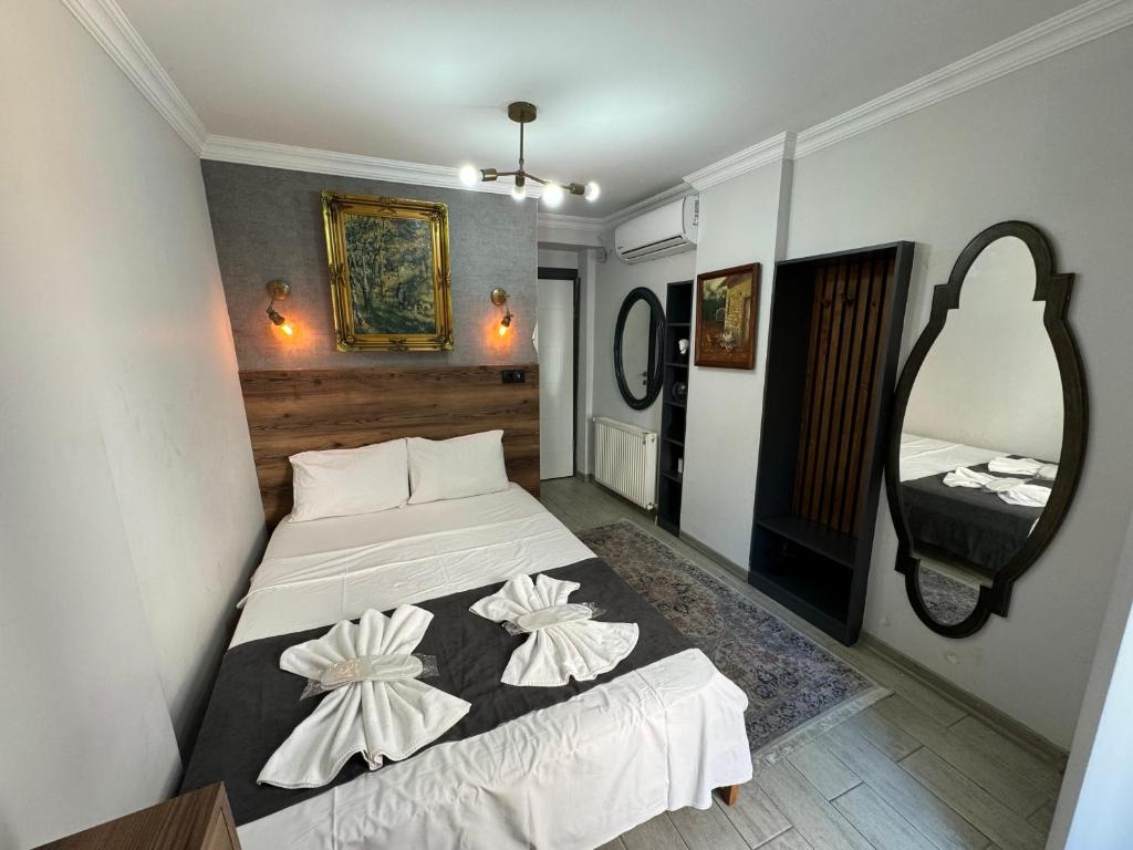 Postel nebo postele na pokoji v ubytování Valeria House