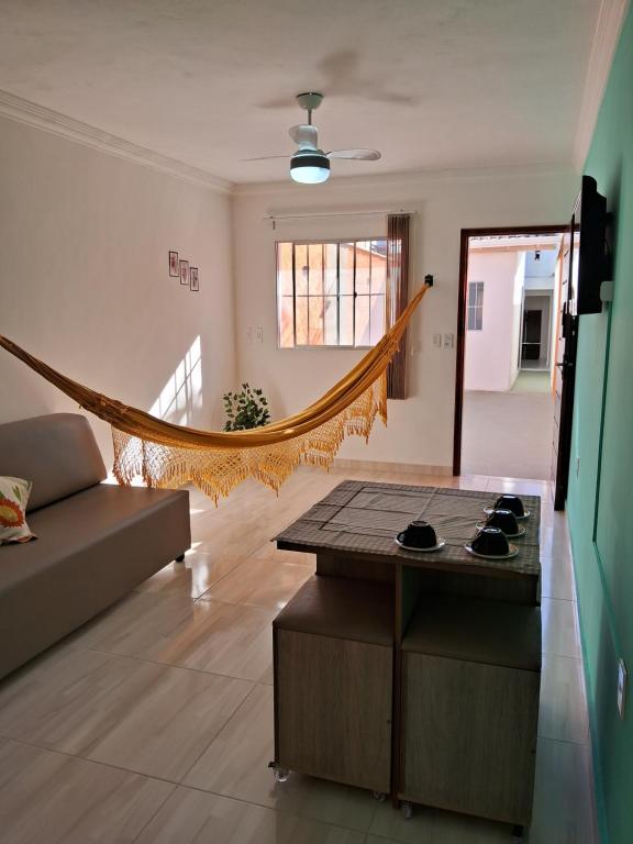 a living room with a couch and a table at Casa Central! Localização Privilegiada! in Porto Seguro