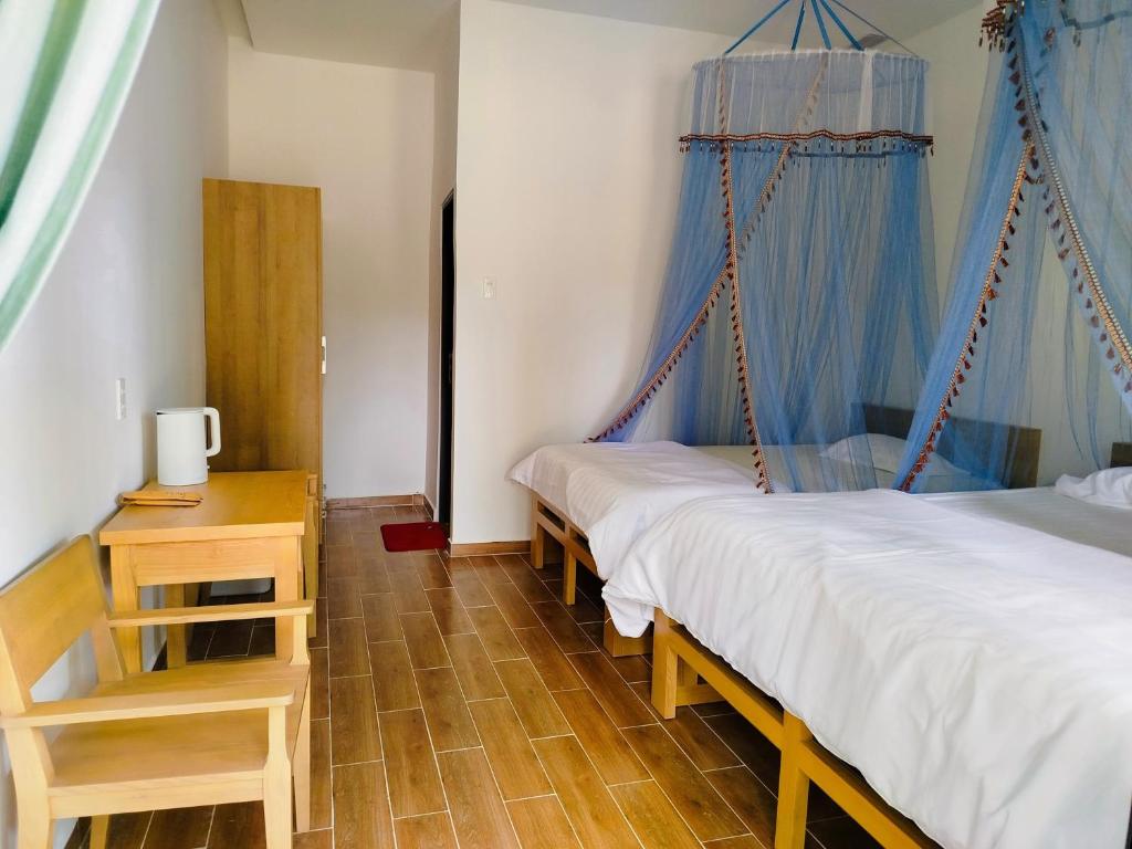 Postel nebo postele na pokoji v ubytování Green Hope Lodge