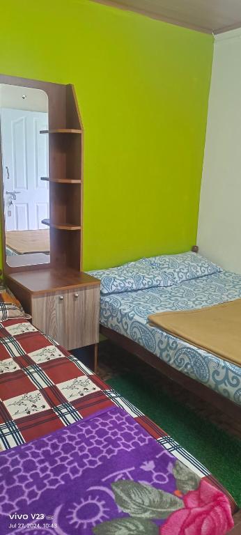 Postel nebo postele na pokoji v ubytování Munnar home stay