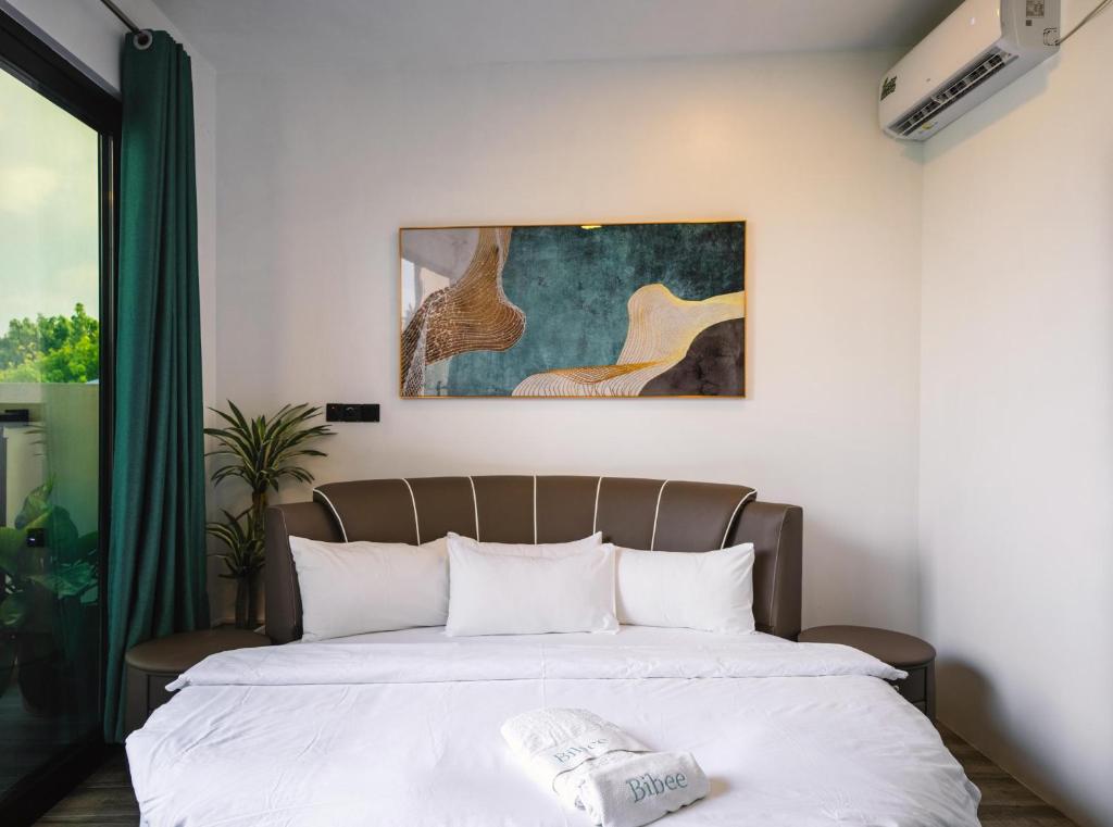 Postel nebo postele na pokoji v ubytování Bibee Maldives