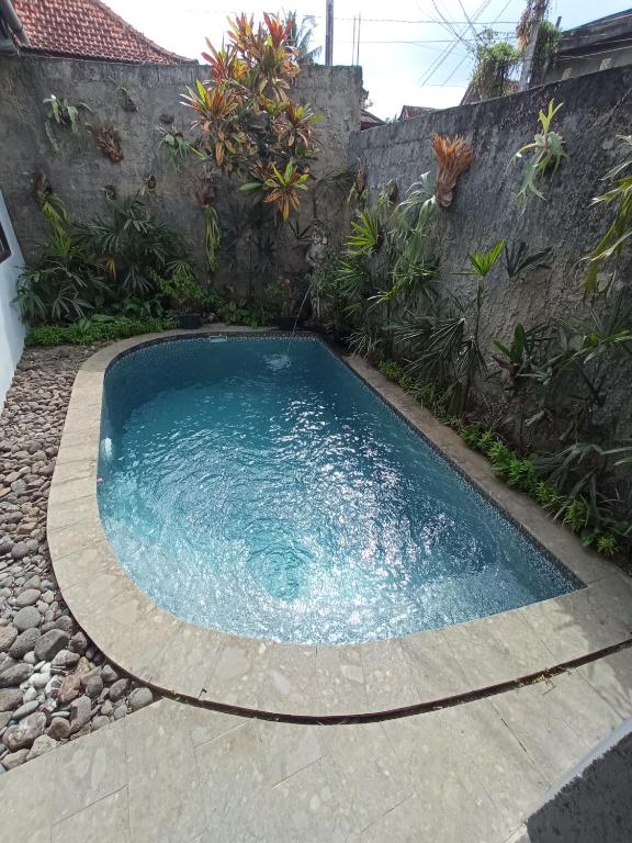 Bazén v ubytování Kampoeng Joglo Abangan Ubud nebo v jeho okolí