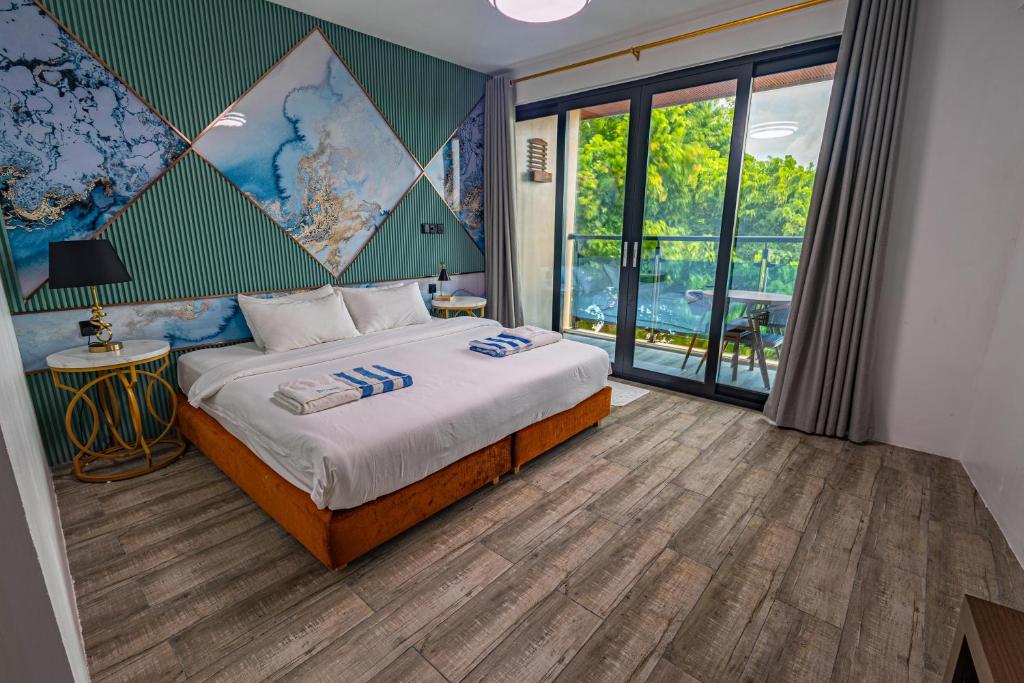 Postel nebo postele na pokoji v ubytování Bibee Maldives